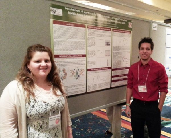 Madelene and Nick presenting their poster